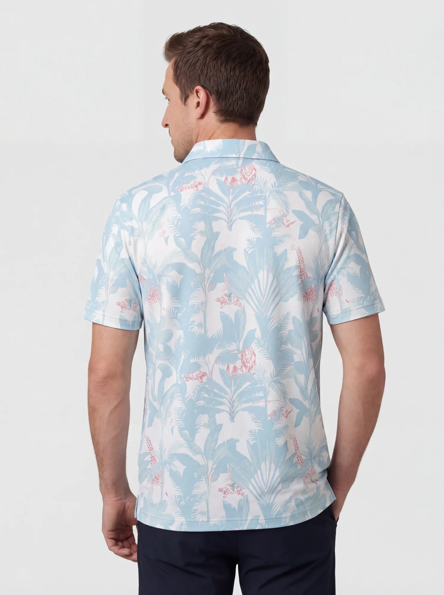 Men's powder blue tropical print polo in powder blue / white / pink, back view