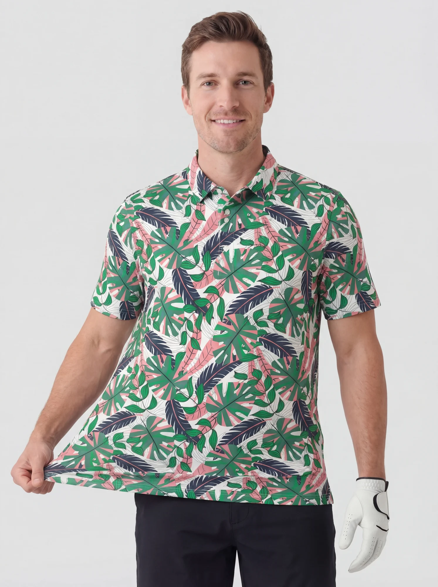 Men's green tropical foliage polo in white / green / pink, alternate front styling view