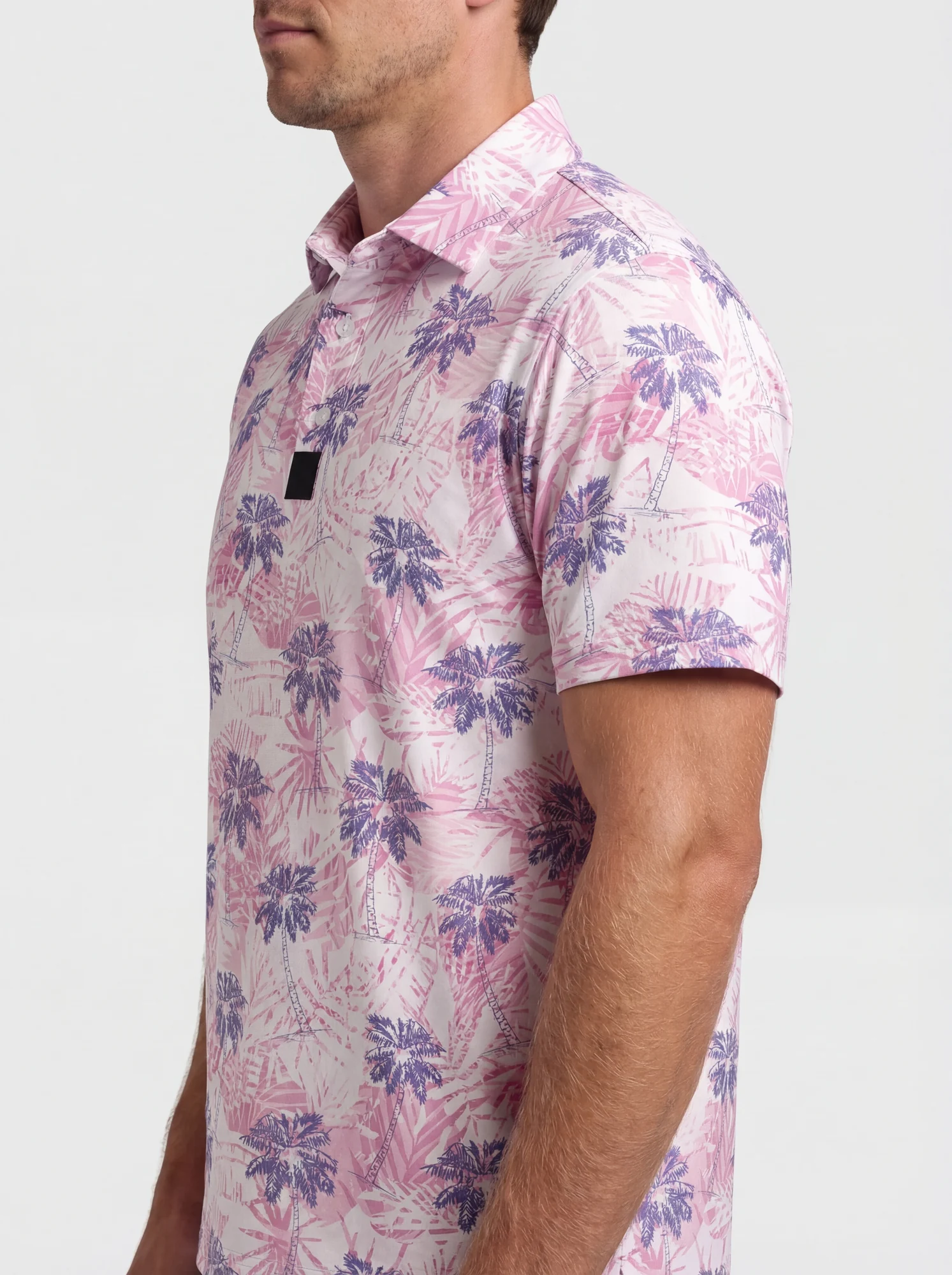 Men's pink & purple palm print polo in pink / purple, shoulder and collar detail view