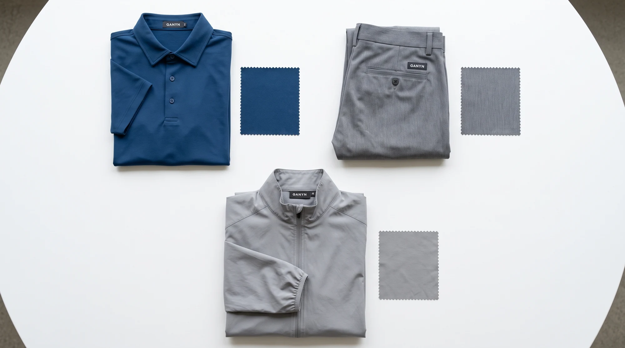 Polo, woven golf trousers and shell jacket with material swatches